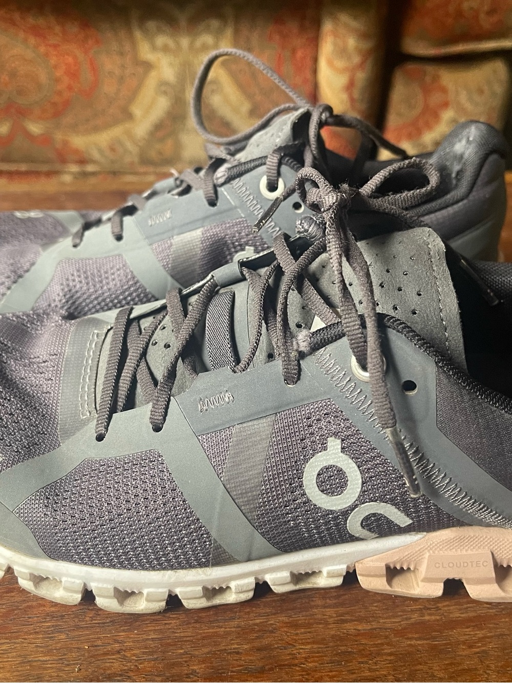 On CloudRunning Athletic Shoes in Charcoal and Light Gray with pink soles